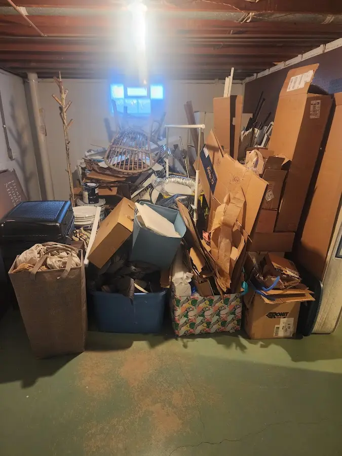 Roll-off dumpster container at job site for 2 Yard Dumpster Rental in Elmwood